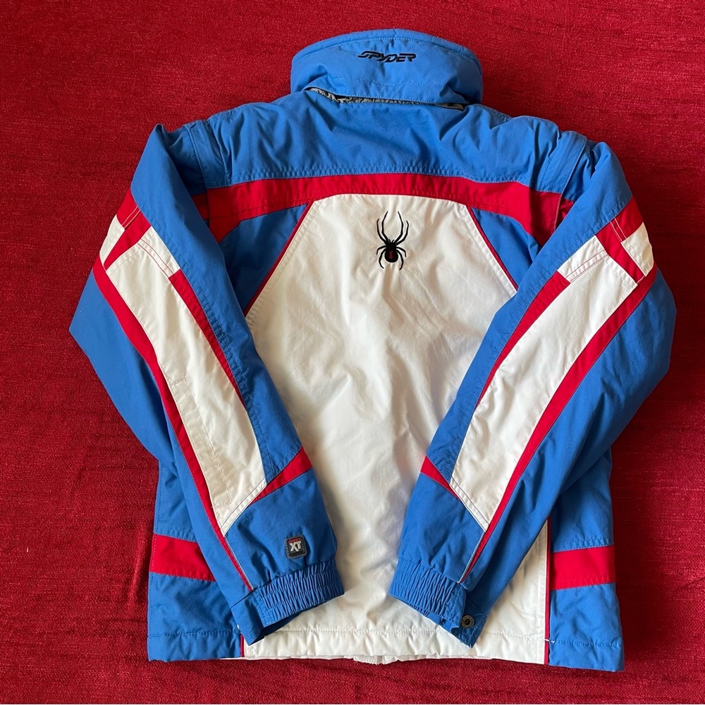 Unisex Spyder XT winter snowboard ski jacket Kids 16. Red, white, and blue.